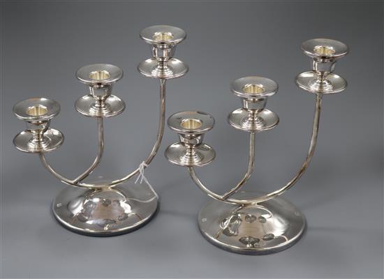 A stylish pair of modern three branch silver candelabra, Birmingham, 2000, 22cm.